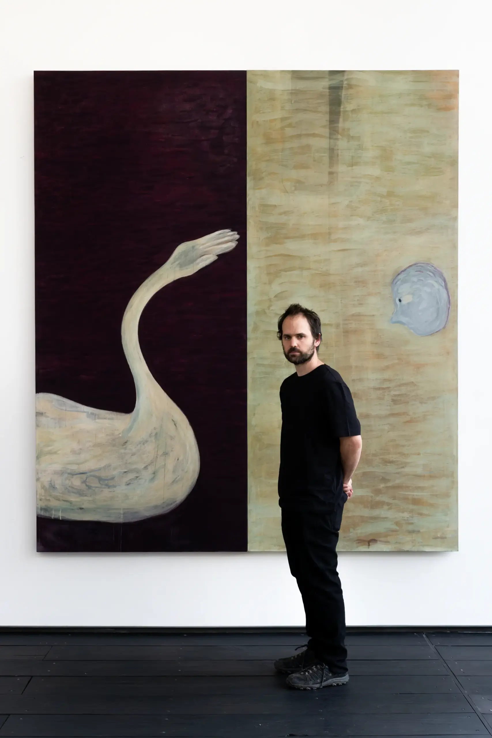 Vicente Matte in front of his art